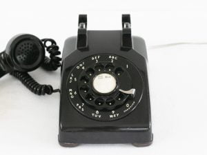 An old style telephone that uses a copper pair traditional analog service rarely used in homes and businesses today.